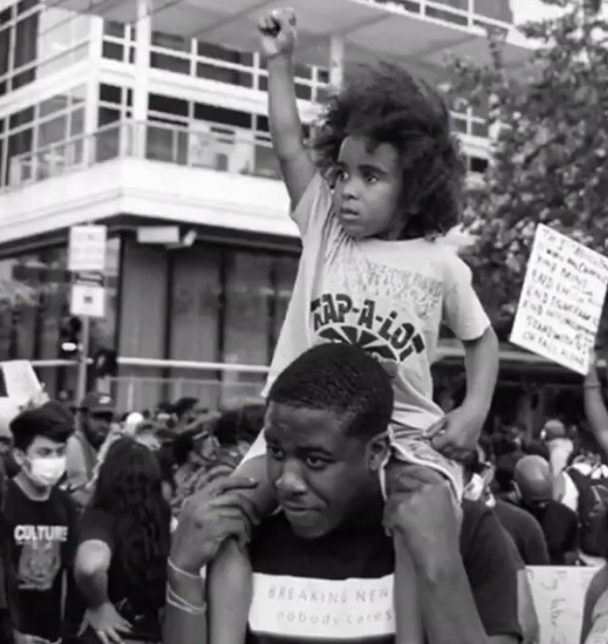 Picture of a Black kid protesting